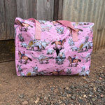 Pink longhorn duffle bag strap detail showing quality hardware and carry handles