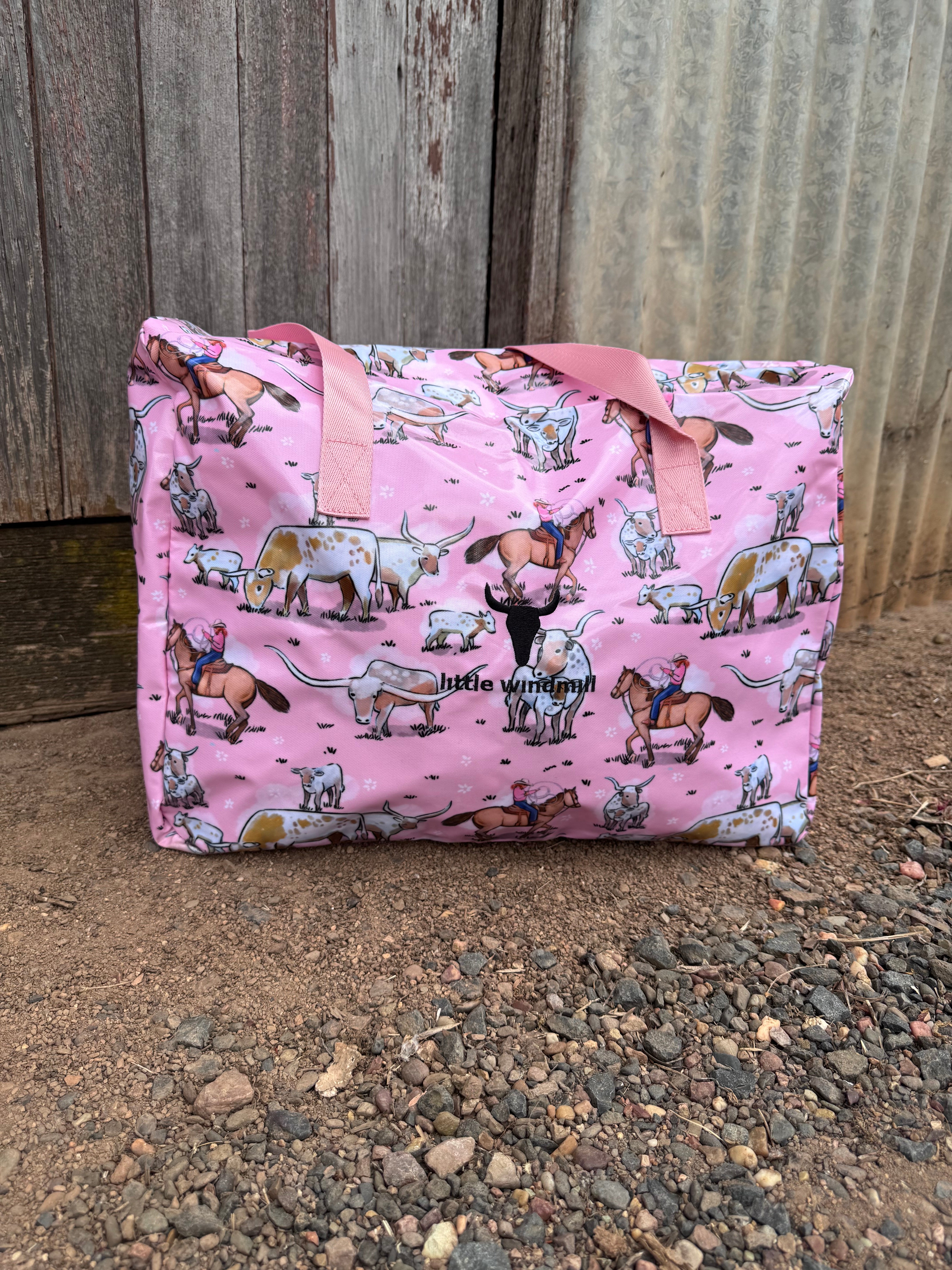 Pink longhorn duffle bag strap detail showing quality hardware and carry handles
