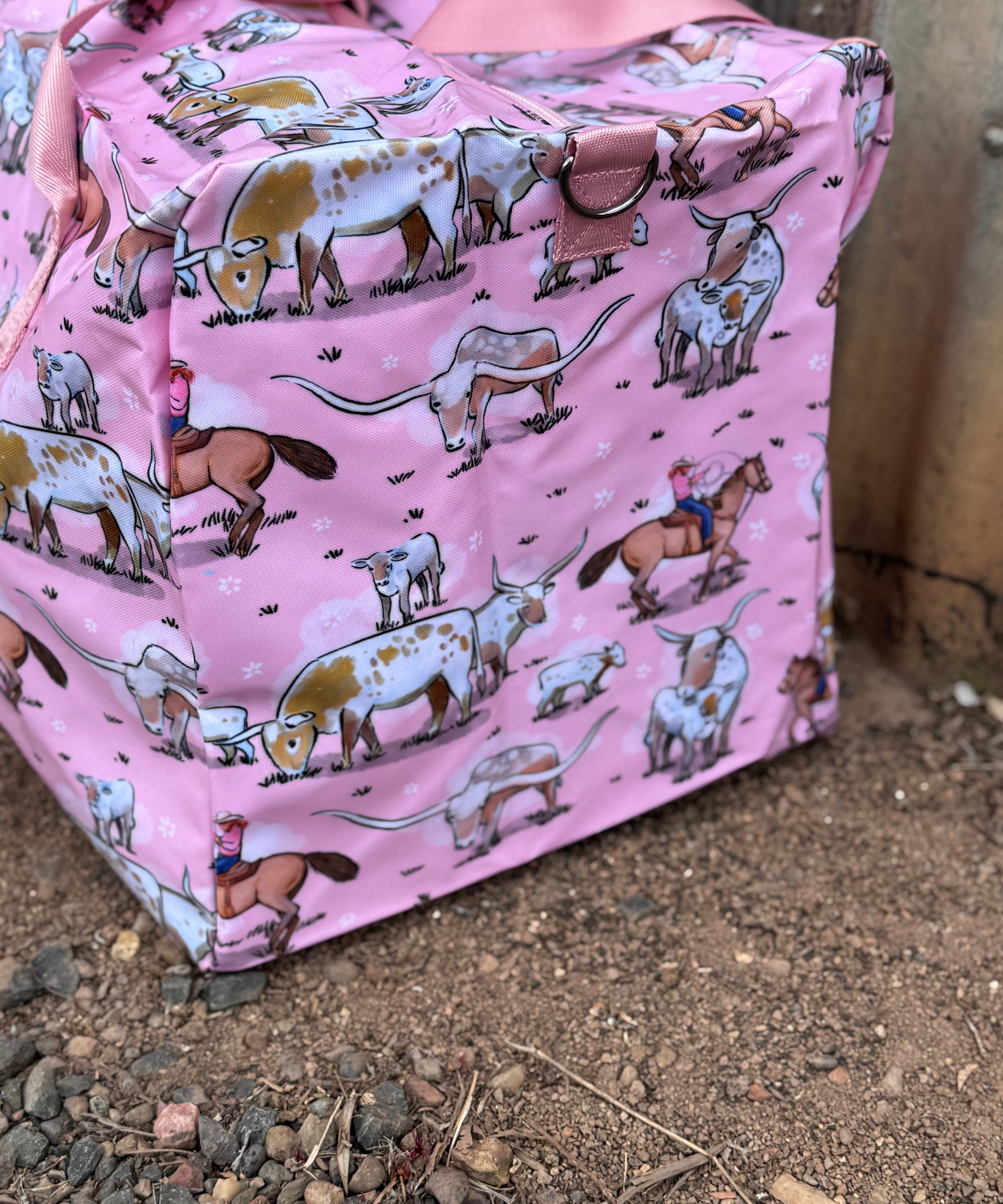 Pink longhorn duffle bag open showing spacious interior and quality zip closure