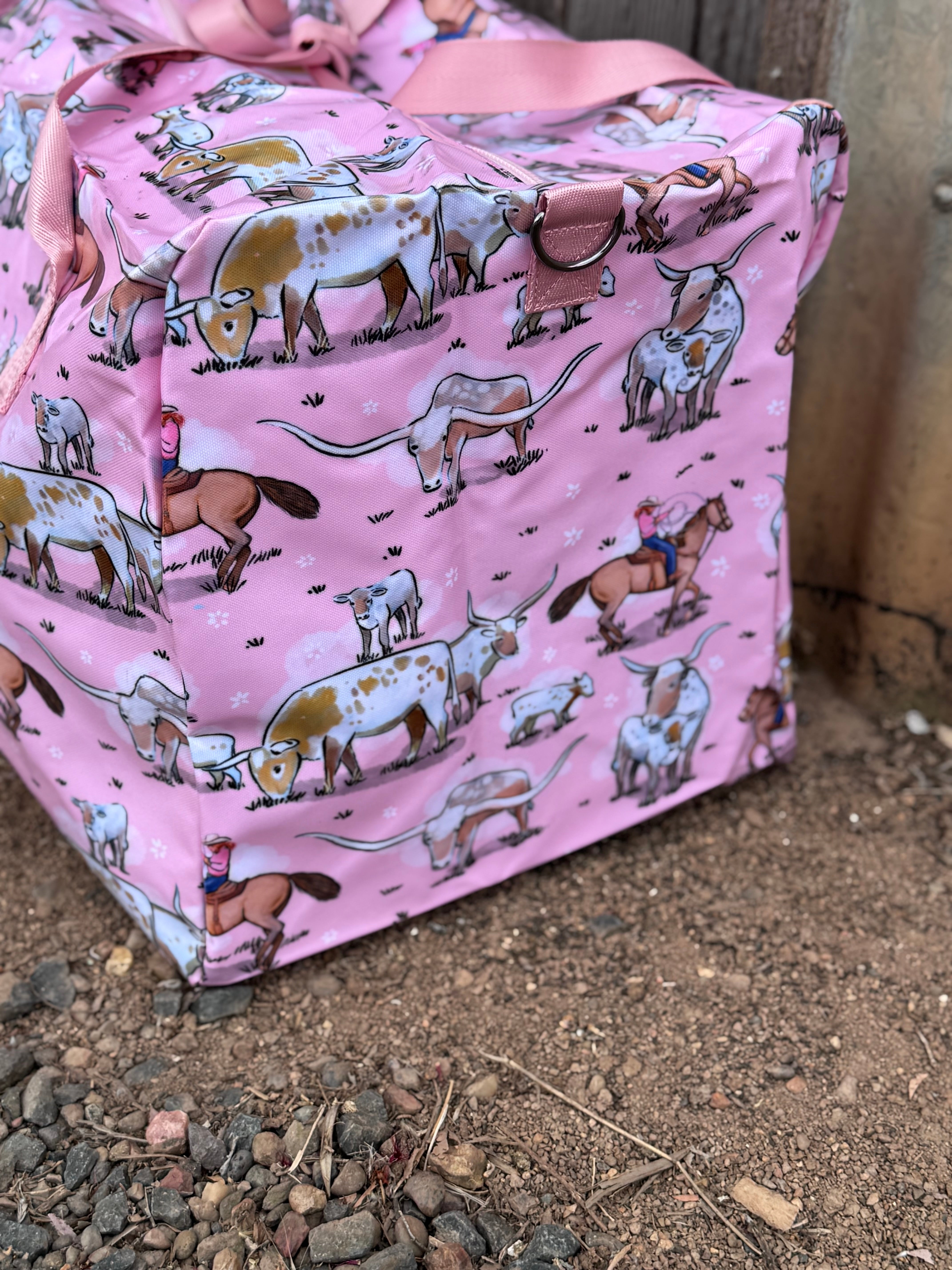Pink longhorn duffle bag open showing spacious interior and quality zip closure