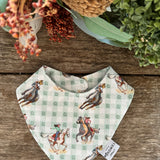 Waterproof teal cowgirl bib showing fun cowgirl print on wipeable teal waterproof fabric