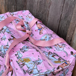 Pink longhorn duffle bag side view showing roomy compartment and bold pink longhorn design