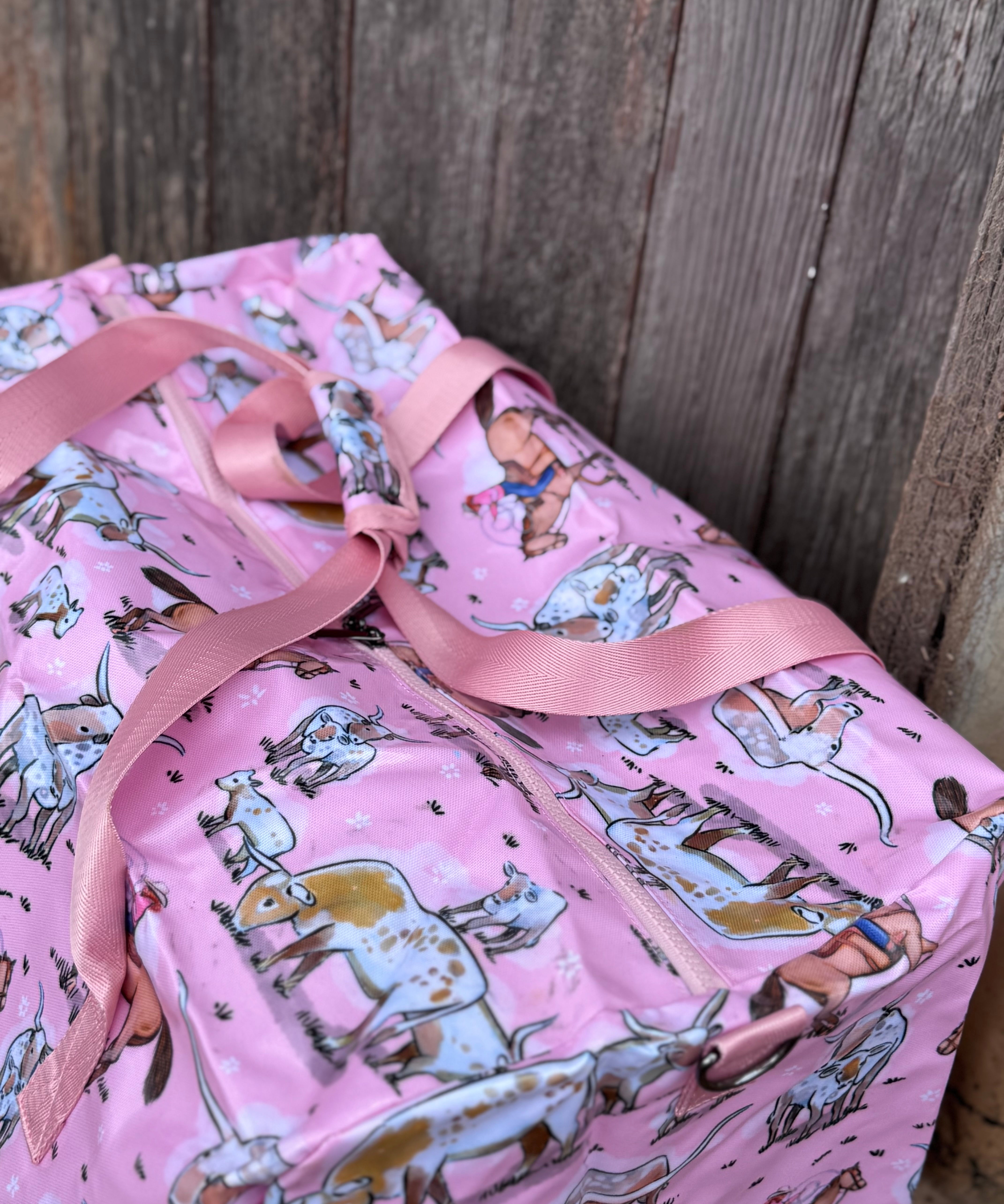 Pink longhorn duffle bag side view showing roomy compartment and bold pink longhorn design