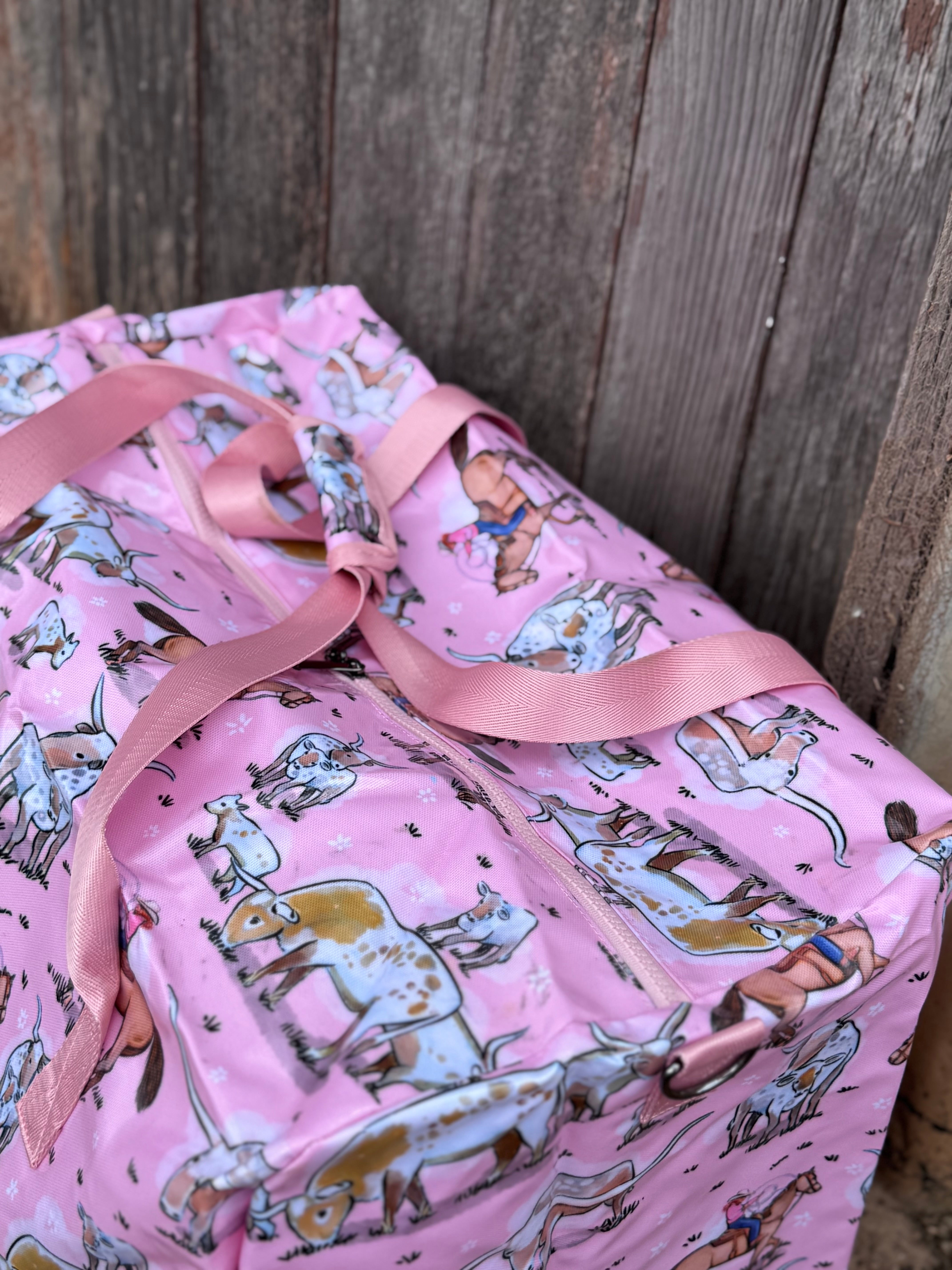 Pink longhorn duffle bag side view showing roomy compartment and bold pink longhorn design