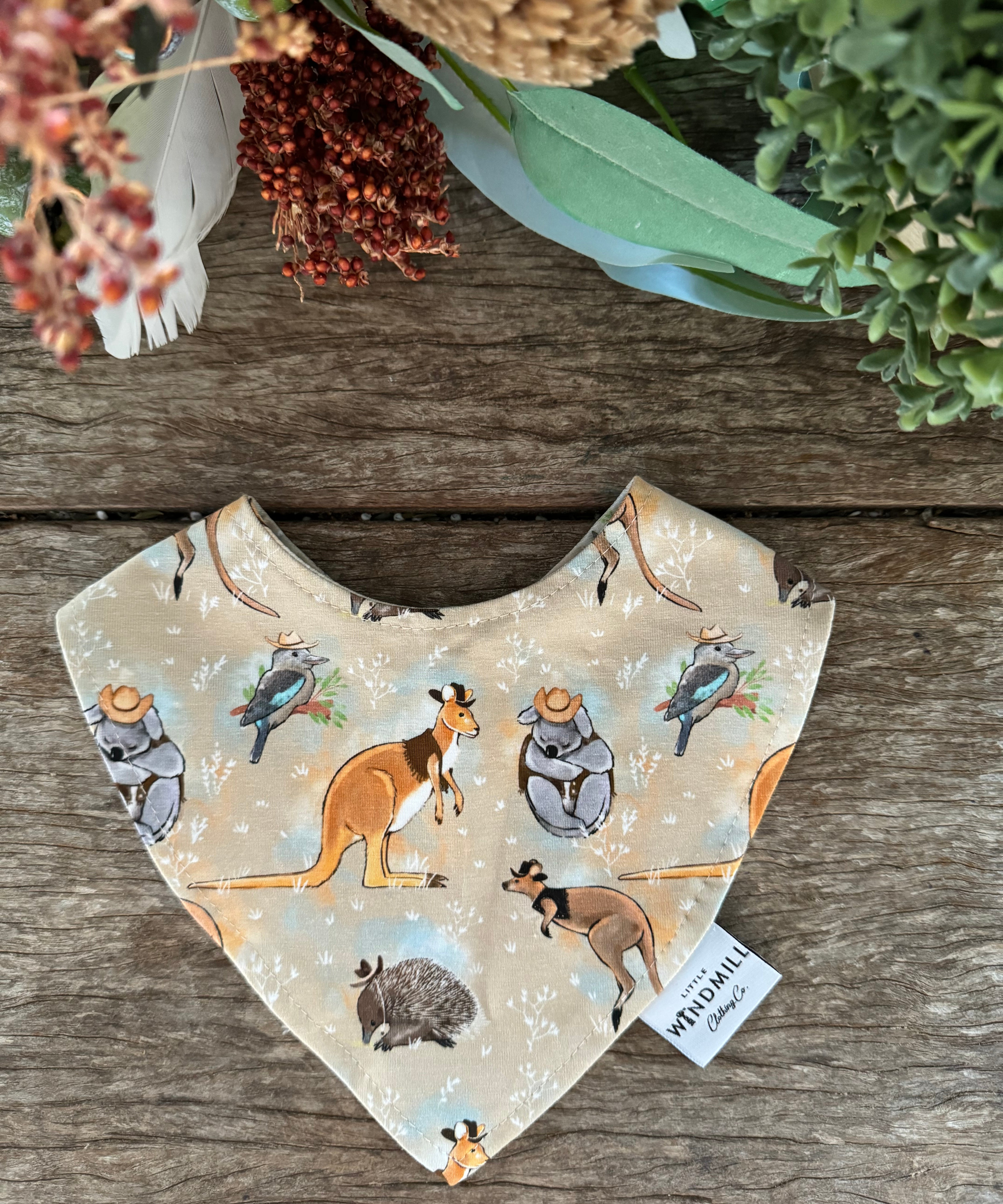 Waterproof Aussie animals bib showing native Australian animal print on wipeable waterproof fabric