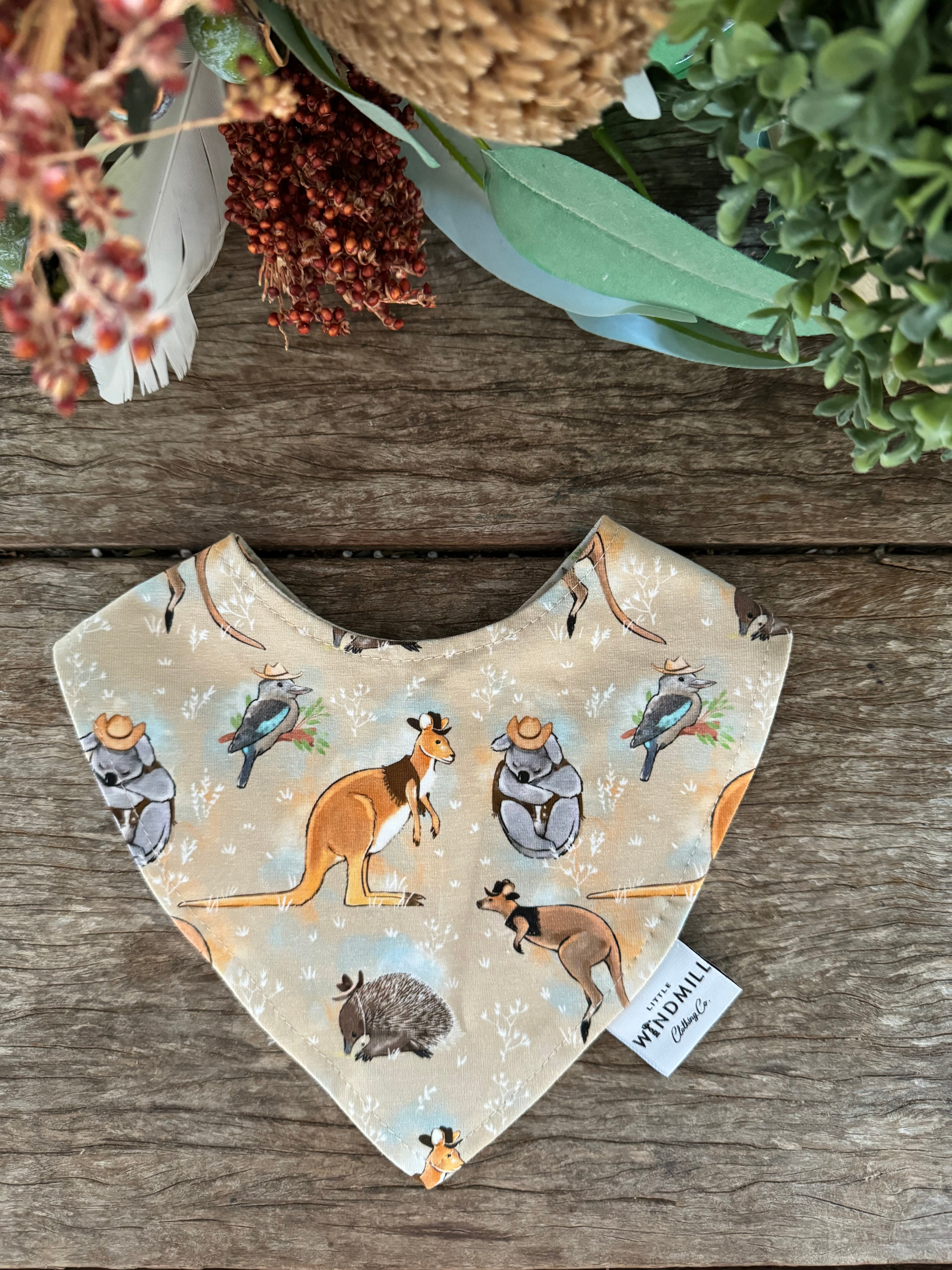 Waterproof Aussie animals bib showing native Australian animal print on wipeable waterproof fabric