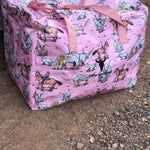 Pink longhorn duffle bag front view showing vibrant pink longhorn cattle print on quality travel bag