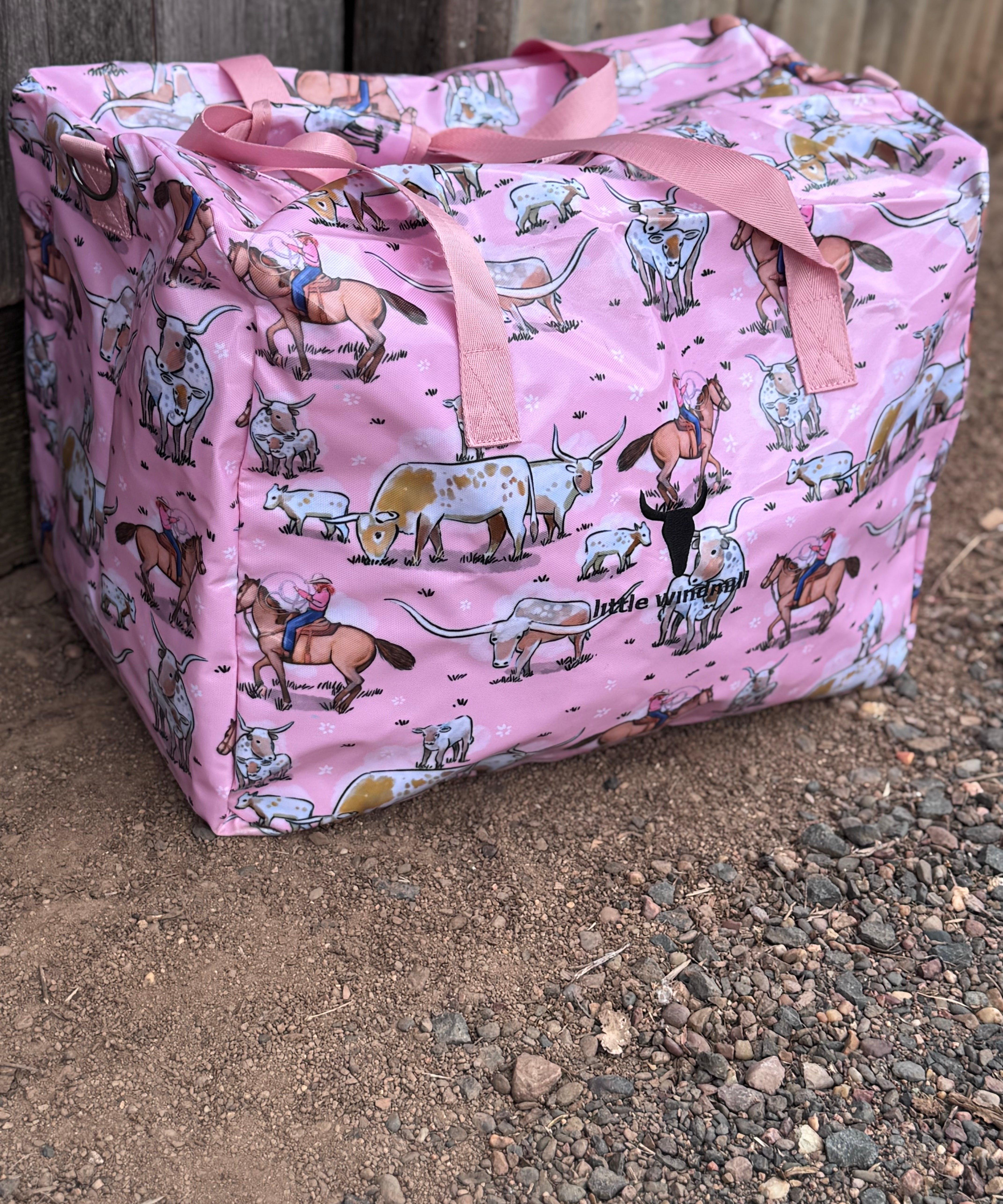 Pink longhorn duffle bag front view showing vibrant pink longhorn cattle print on quality travel bag