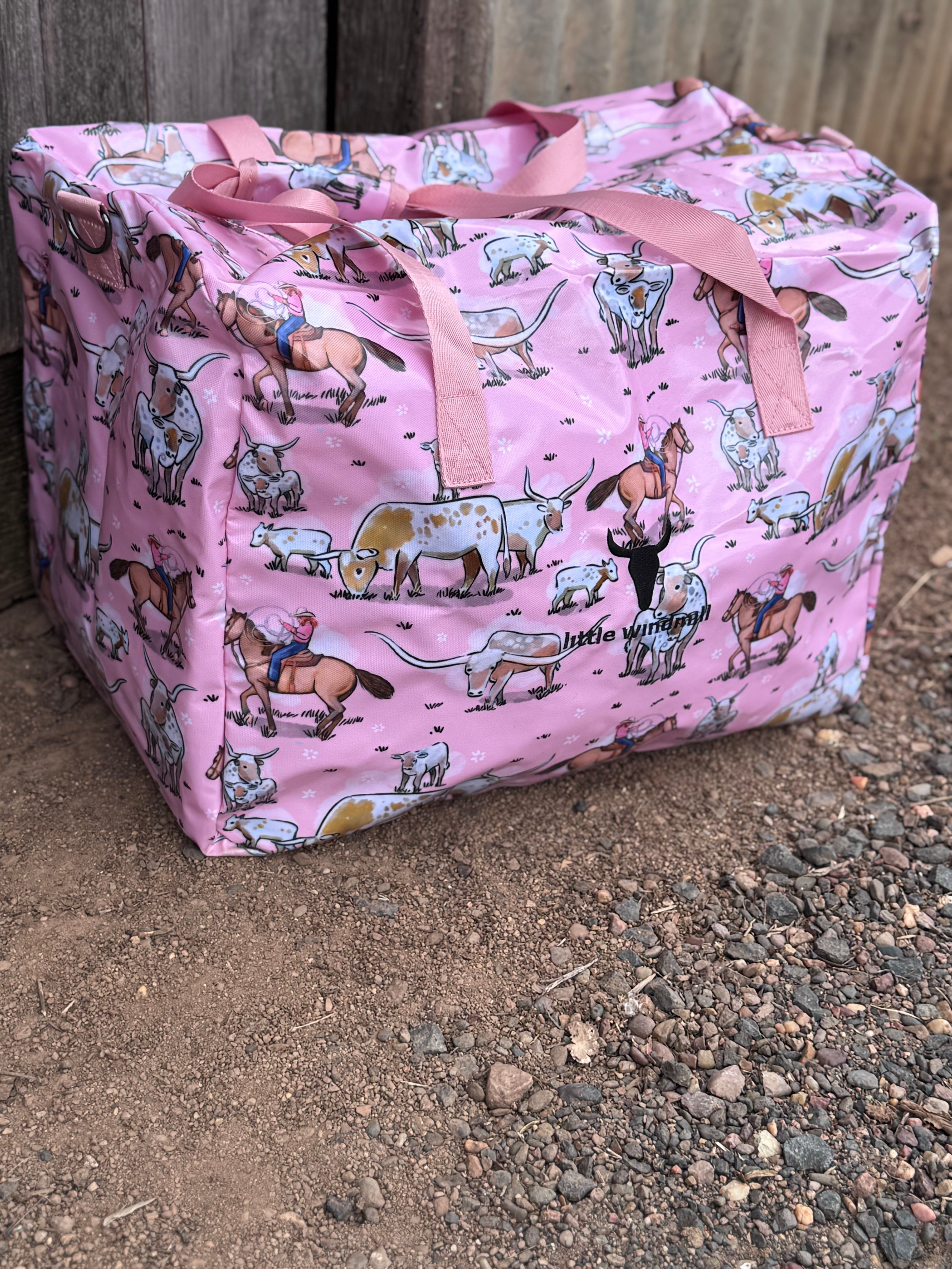 Pink longhorn duffle bag front view showing vibrant pink longhorn cattle print on quality travel bag