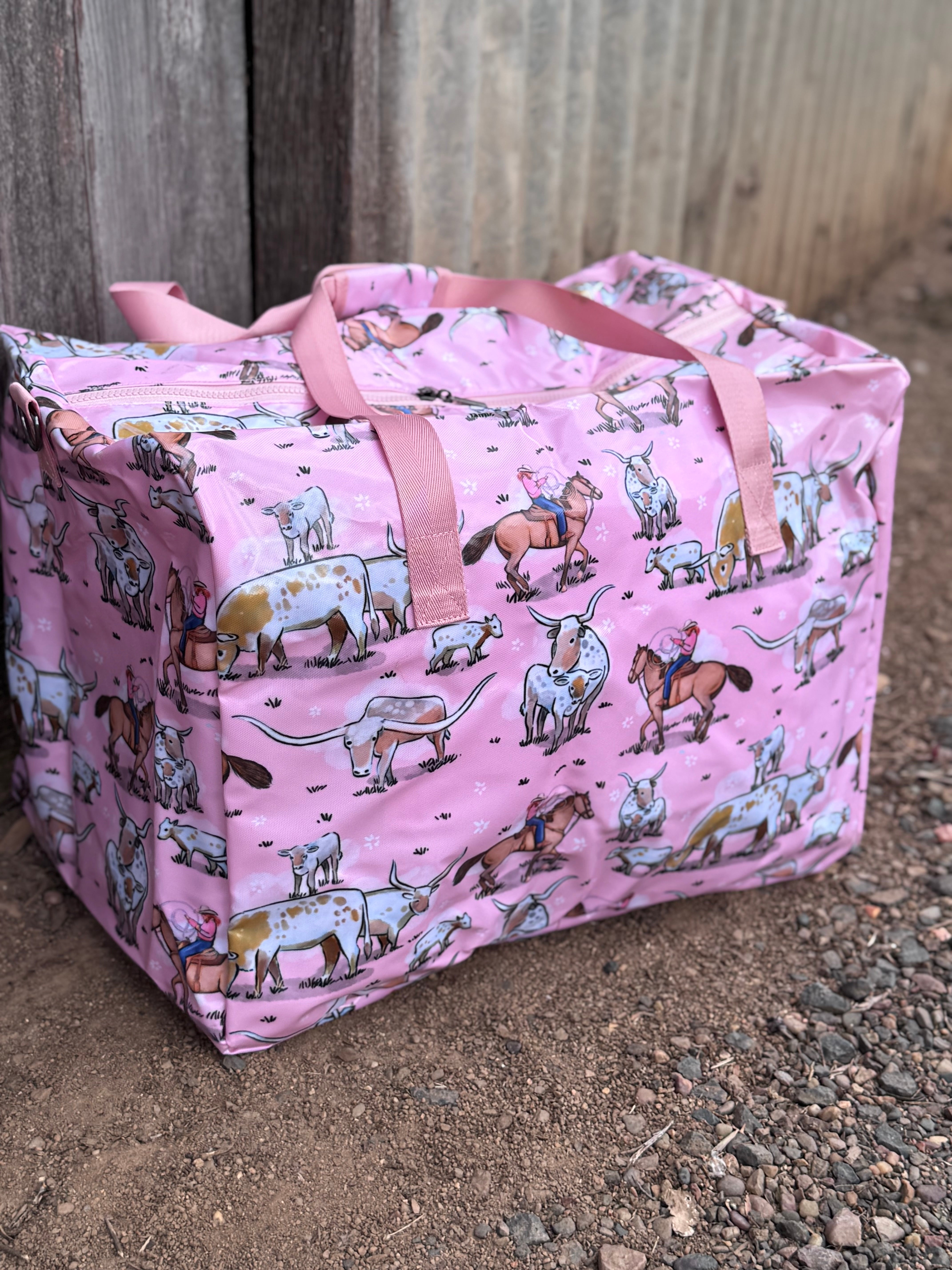 Pink longhorn duffle bag print close-up showing detailed longhorn cattle graphic in bold pink