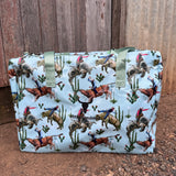 Bucking bull duffle bag front view showing bold rodeo bucking bull print on durable travel bag