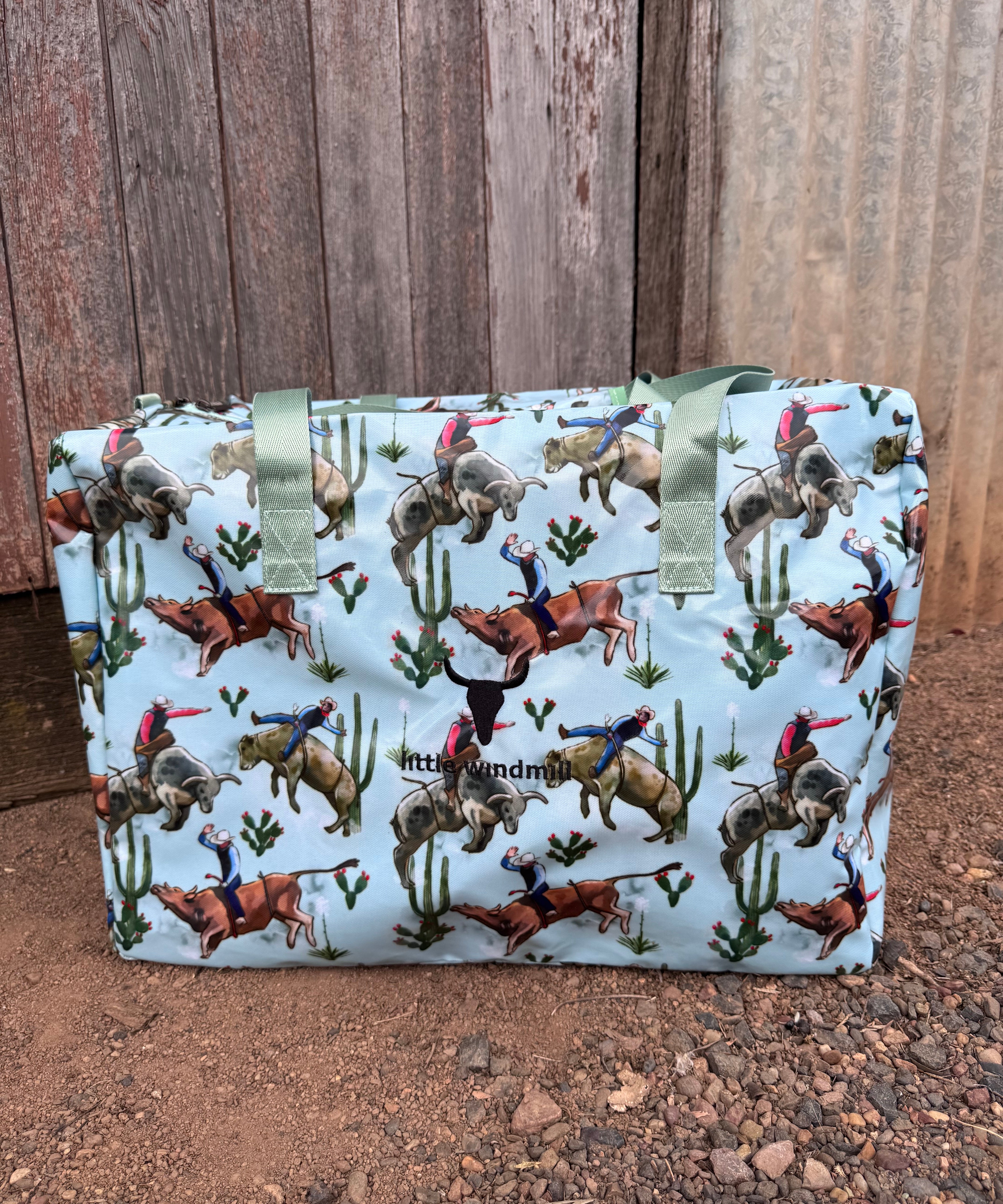 Bucking bull duffle bag front view showing bold rodeo bucking bull print on durable travel bag