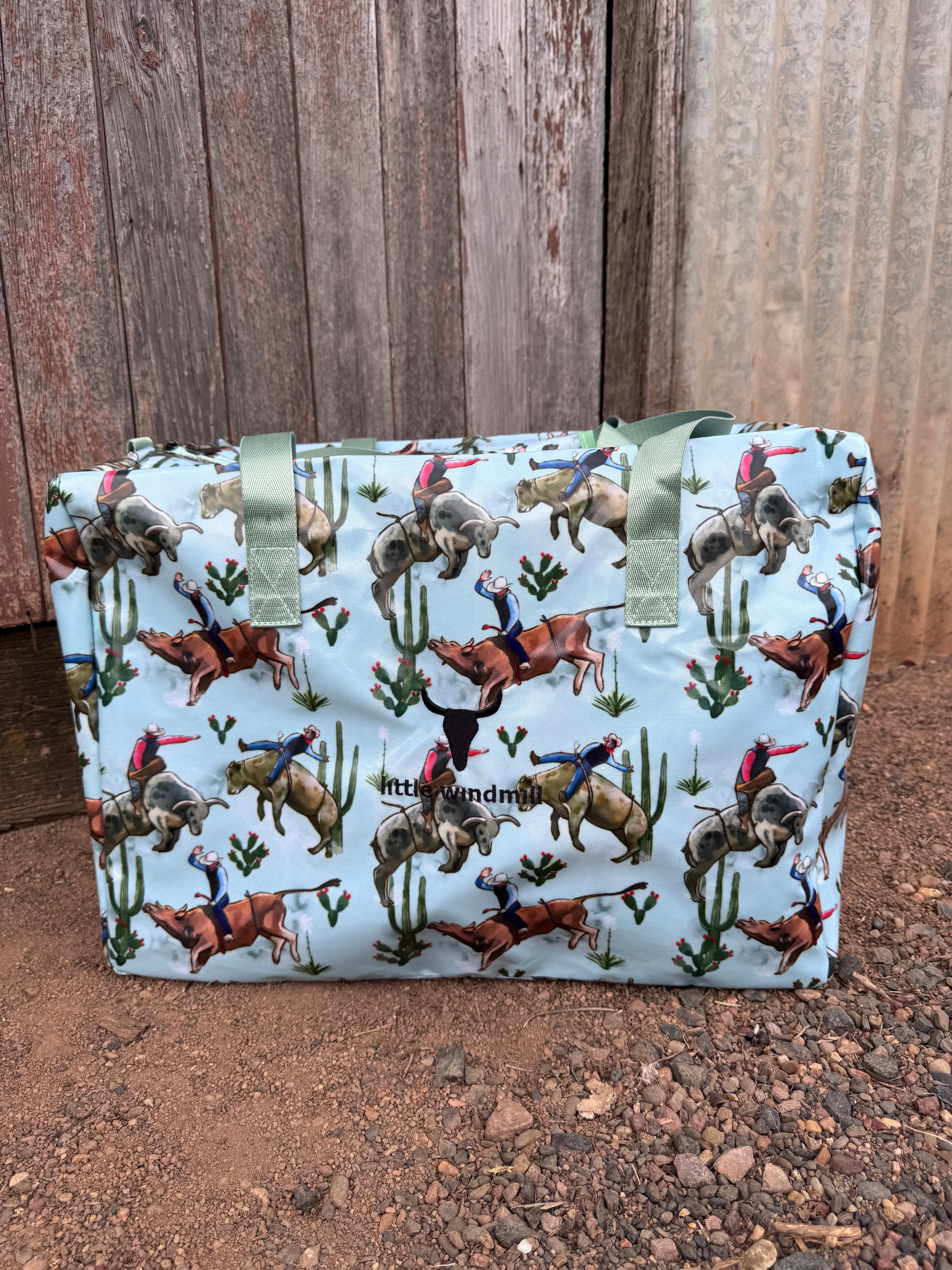 Bucking bull duffle bag front view showing bold rodeo bucking bull print on durable travel bag