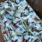Bucking bull duffle bag flatlay showing full western rodeo bull riding print design