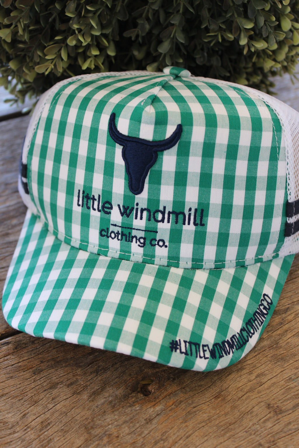 Toddlers and youth kids wearing green gingham trucker caps with mesh tops and adjustable straps