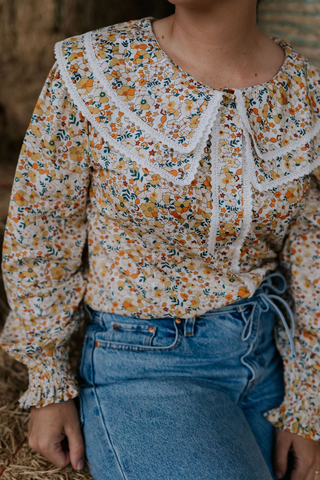 Britt yellow floral women's shirt side view showing relaxed fit and vibrant yellow floral pattern