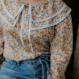 Britt yellow floral women's shirt worn showing cheerful yellow floral country casual style