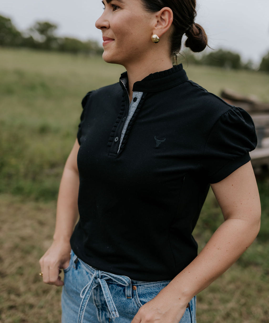 NURSING Kellie ruffle women's black gingham contrast polo front view showing chic nursing-friendly black gingham polo with ruffle