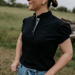 NURSING Kellie ruffle women's black gingham contrast polo front view showing chic nursing-friendly black gingham polo with ruffle