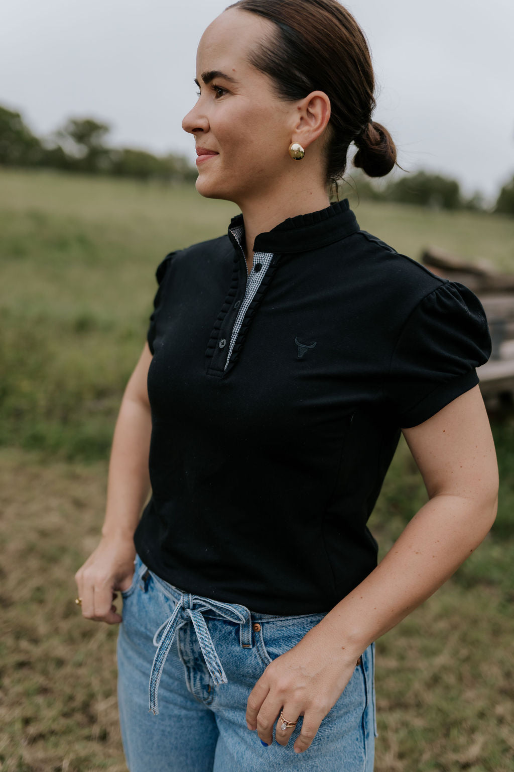NURSING Kellie ruffle women's black gingham contrast polo front view showing chic nursing-friendly black gingham polo with ruffle