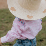 Lara multi stripe pink ruffle long sleeve romper flatlay showing full pink stripe ruffle design