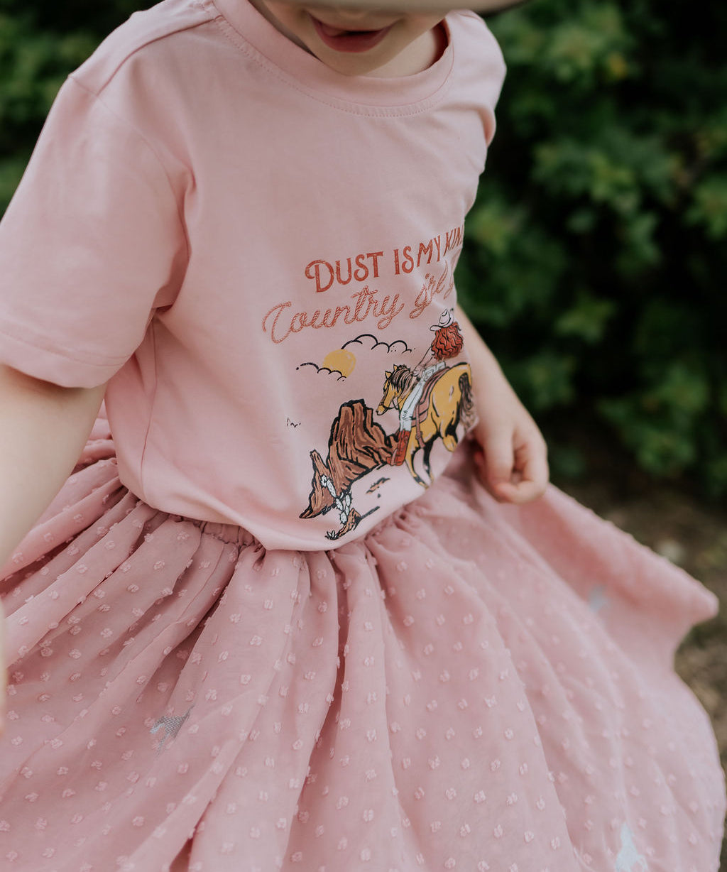Country Girl Glitter Yeehaw graphic kids tee worn by child showing fun glitter country girl style