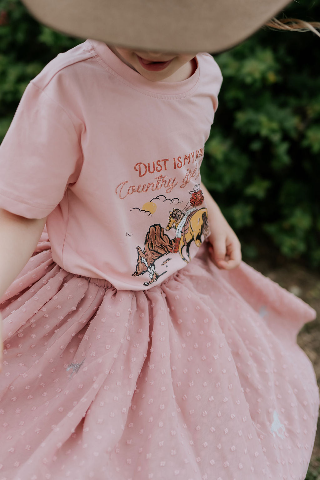 Country Girl Glitter Yeehaw graphic kids tee worn by child showing fun glitter country girl style