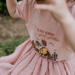 Country Girl Glitter Yeehaw graphic kids tee back view showing relaxed fit on quality kids tee