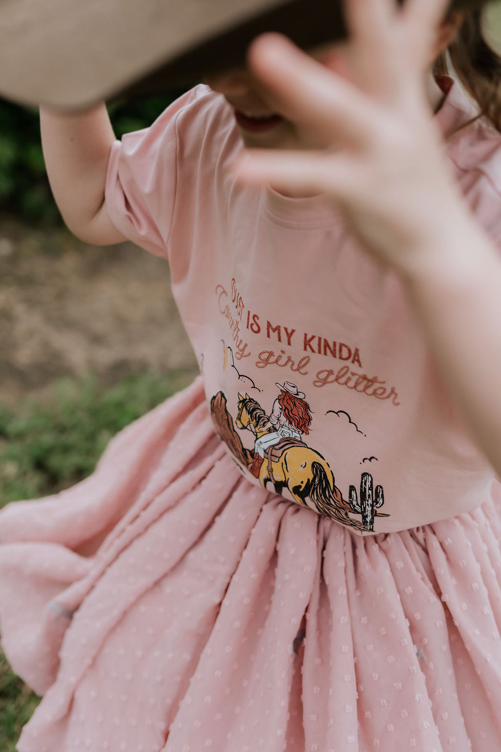 Country Girl Glitter Yeehaw graphic kids tee back view showing relaxed fit on quality kids tee