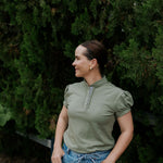 Kate khaki ruffled collar women's polo shirt flatlay showing full khaki ruffle polo design