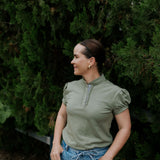 Kate khaki ruffled collar women's polo shirt flatlay showing full khaki ruffle polo design