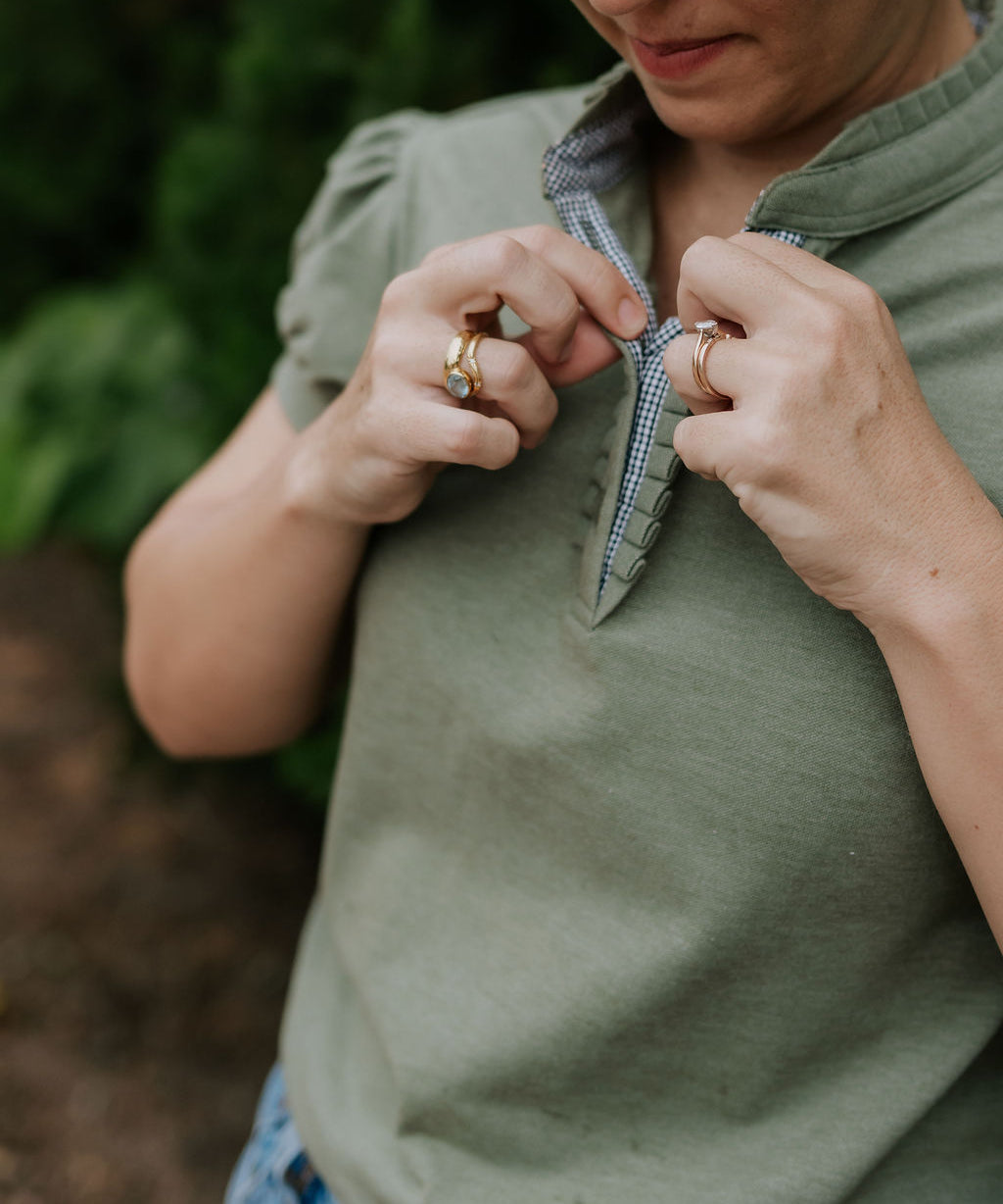 Kate khaki ruffled collar women's polo shirt worn showing polished khaki ruffle collar country style