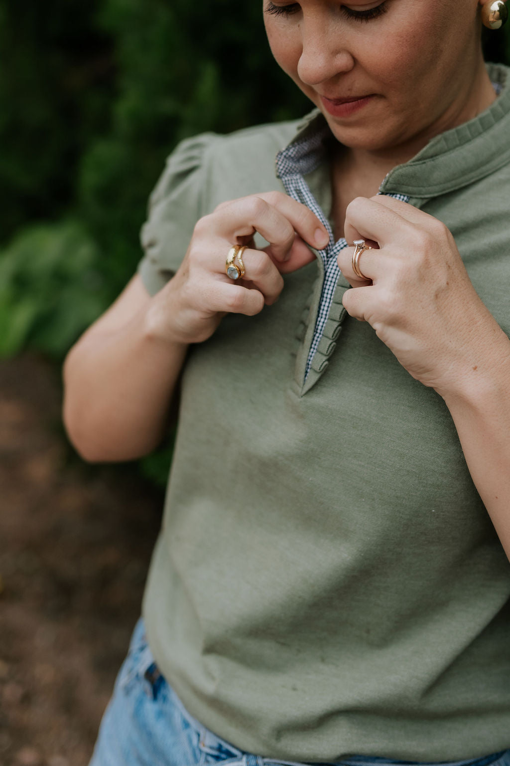 Kate khaki ruffled collar women's polo shirt worn showing polished khaki ruffle collar country style