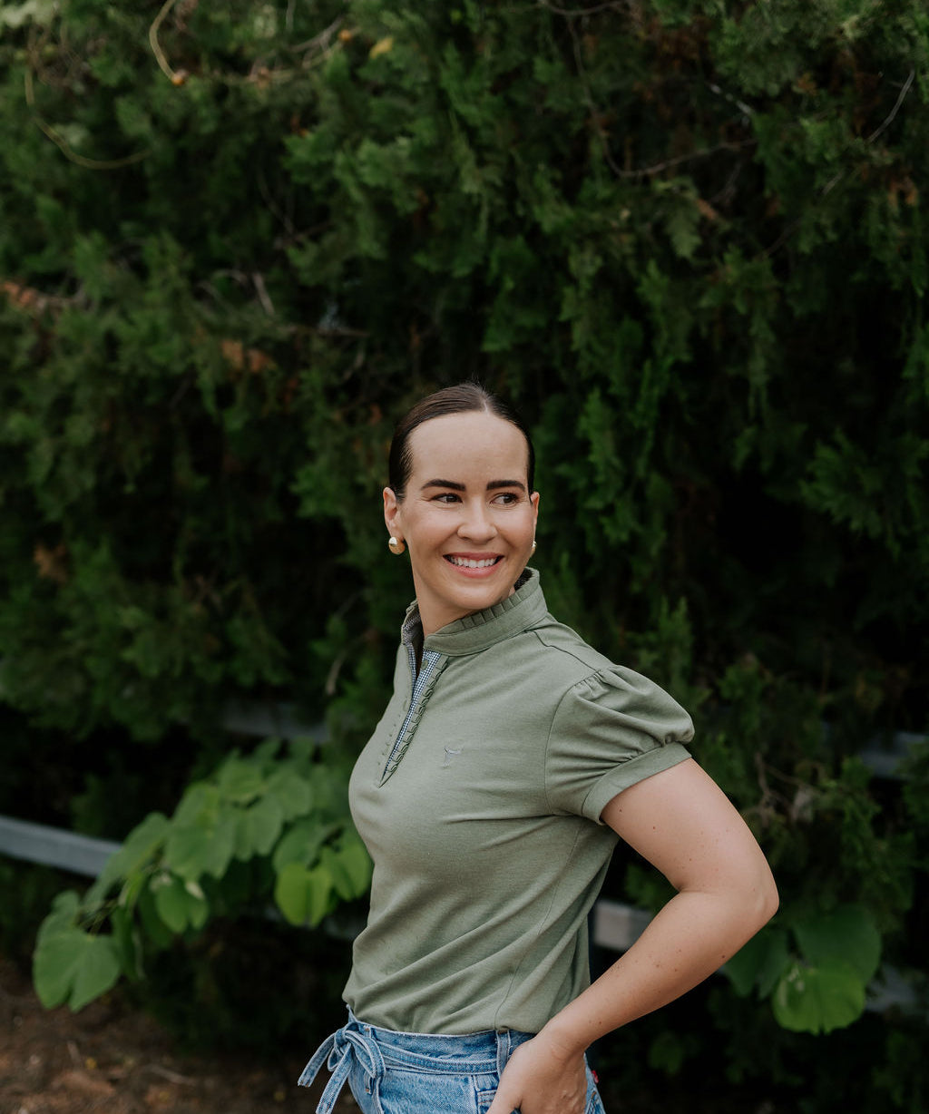 Kate khaki ruffled collar women's polo shirt back view showing relaxed women's fit in khaki