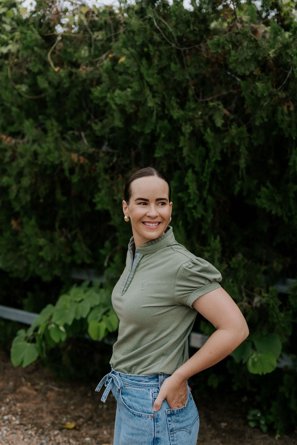 Kate khaki ruffled collar women's polo shirt back view showing relaxed women's fit in khaki