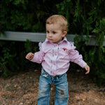 Lara multi stripe pink ruffle long sleeve romper back view showing snap closure and pink stripe ruffle
