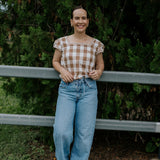 Dusty gingham women's blouse cuff detail showing quality sleeve and button finish