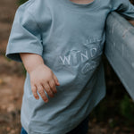 LWCC embroidered kids tee powder blue embroidery close-up showing LWCC logo stitch on powder blue