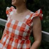 Orange check linen women's blouse fabric close-up showing quality orange check linen weave