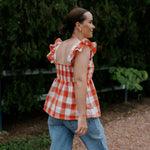 Orange check linen women's blouse worn showing stylish country casual women's look in orange check