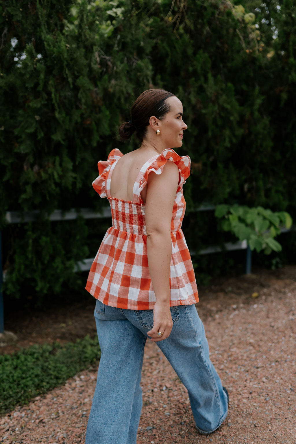 Orange check linen women's blouse worn showing stylish country casual women's look in orange check