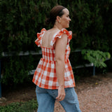 Orange check linen women's blouse worn showing stylish country casual women's look in orange check