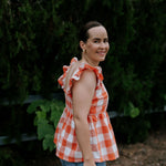 Orange check linen women's blouse collar detail showing neat linen collar and button placket