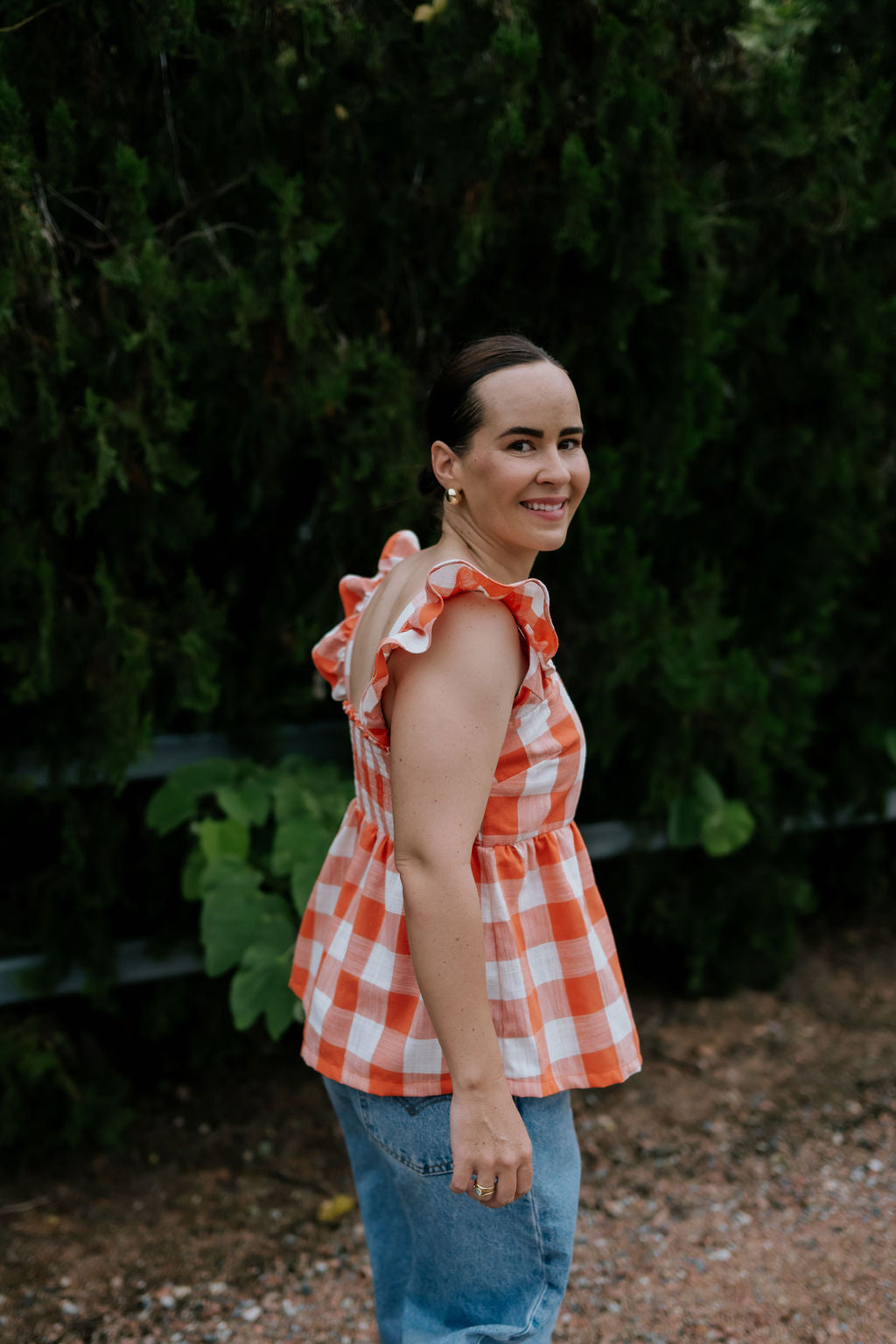 Orange check linen women's blouse collar detail showing neat linen collar and button placket