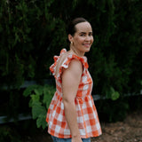 Orange check linen women's blouse collar detail showing neat linen collar and button placket