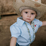 Dasha soft baby blue gingham short sleeve romper print close-up showing soft blue gingham check