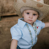 Dasha soft baby blue gingham short sleeve romper print close-up showing soft blue gingham check