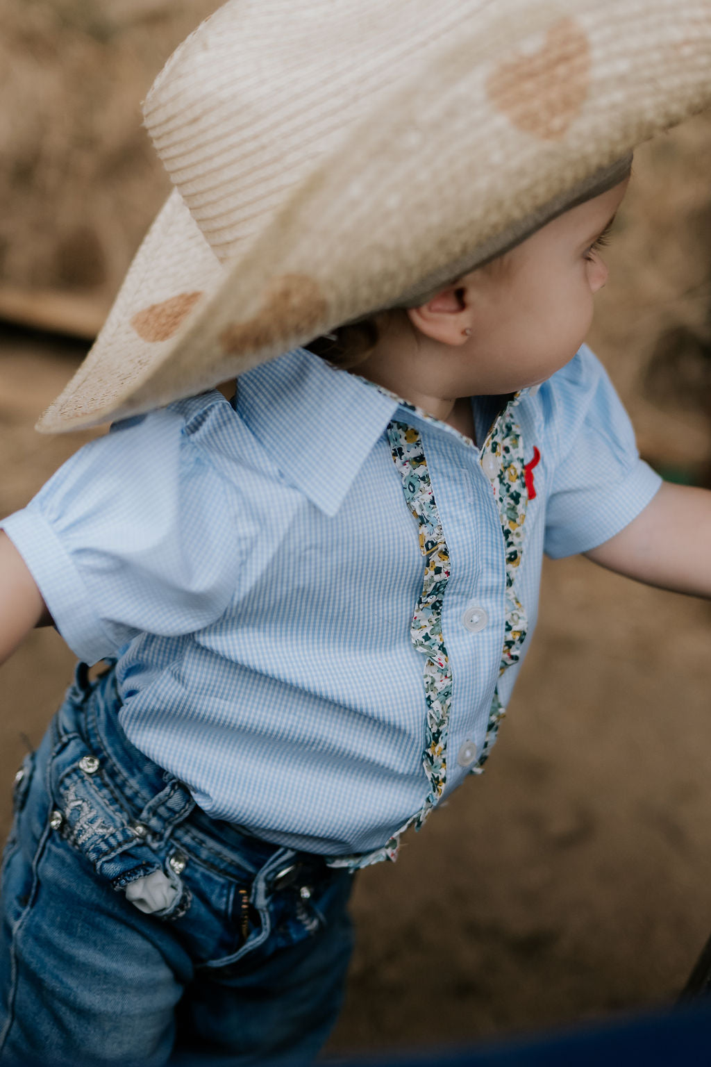 Dasha soft baby blue gingham short sleeve romper snap detail showing quality press stud