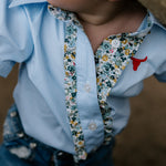 Dasha soft baby blue gingham short sleeve romper fabric close-up showing quality soft blue gingham