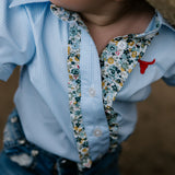 Dasha soft baby blue gingham short sleeve romper fabric close-up showing quality soft blue gingham